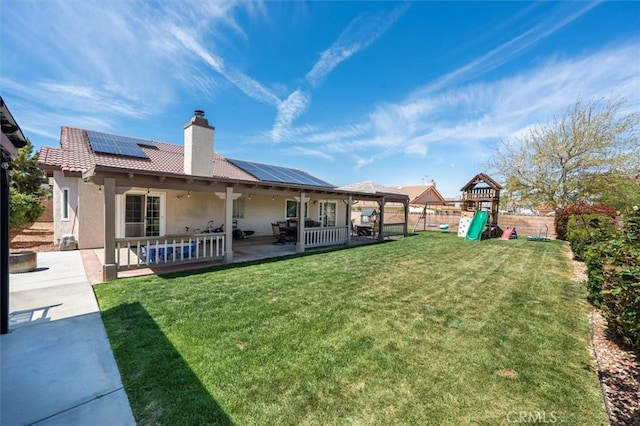 42370 61st St W, Lancaster, CA 93536 - fenced backyard with a playground and a patio