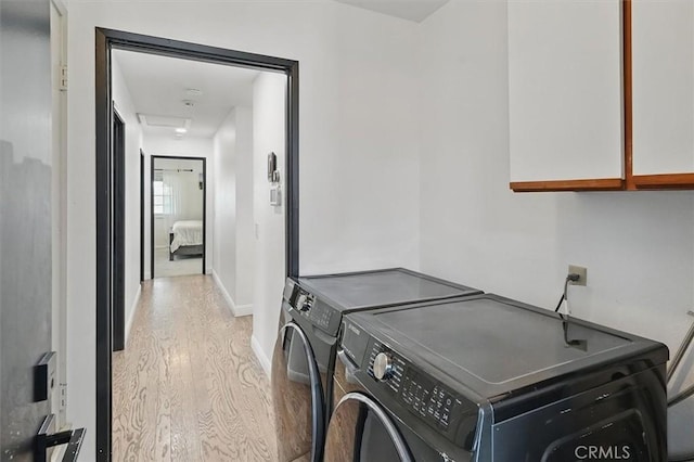 42370 61st St W, Lancaster, CA 93536 - washroom with cabinet space, washer and dryer, and wood finished floors