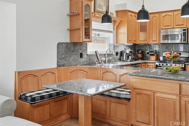 42370 61st St W, Lancaster, CA 93536 - kitchen with stainless steel appliances, tasteful backsplash, glass insert cabinets, and dark stone countertops
