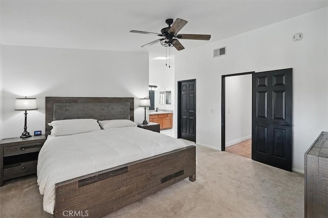 42370 61st St W, Lancaster, CA 93536 - bedroom featuring light colored carpet, connected bathroom, and a ceiling fan