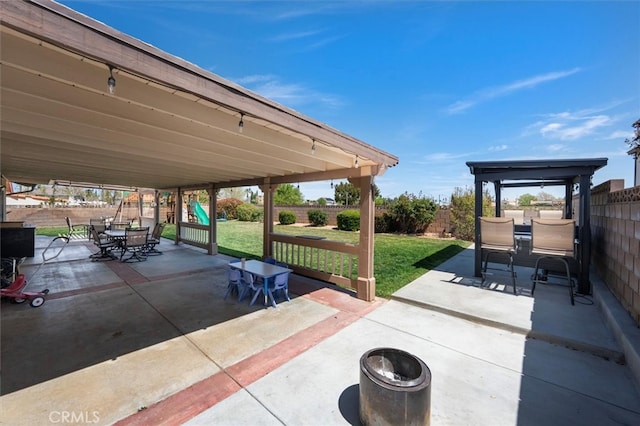 42370 61st St W, Lancaster, CA 93536 - fenced backyard with outdoor dining area, a playground, and a patio