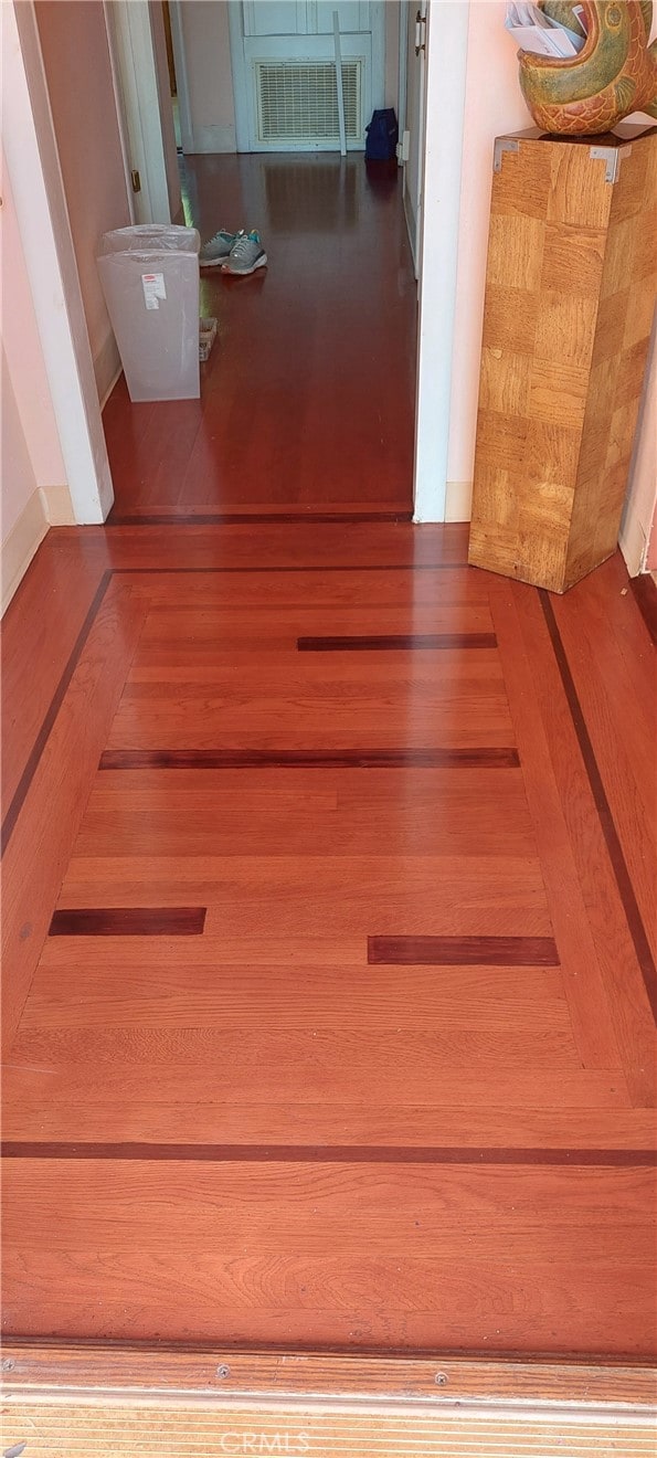 room details with visible vents and wood finished floors