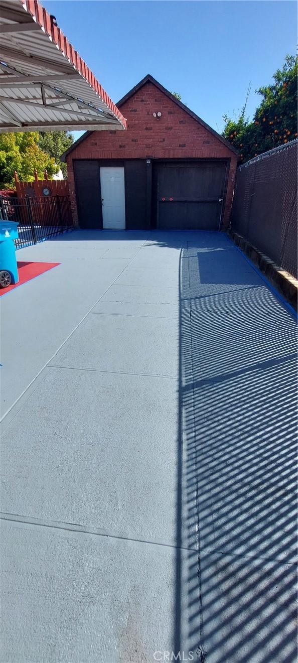 garage featuring fence