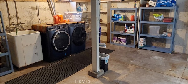laundry room with laundry area and washer and clothes dryer