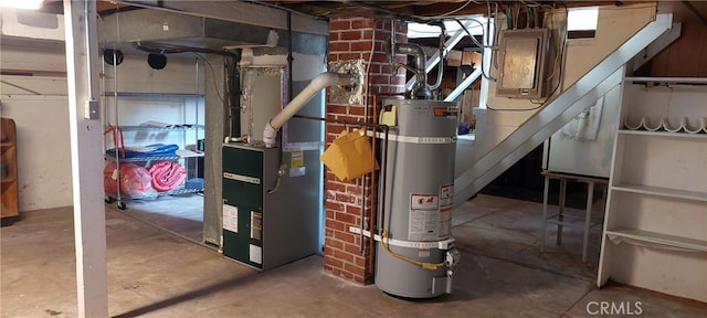 utility room with strapped water heater and heating unit