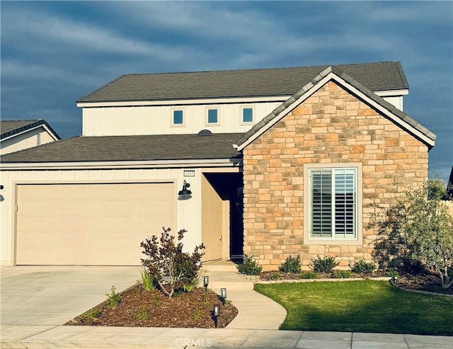 1093 Traverse Dr S, Madera, CA 93636 - traditional home featuring a shingled roof, driveway, a front lawn, and stone siding