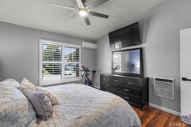 bedroom with wood finished floors, a wall mounted air conditioner, baseboards, and a ceiling fan