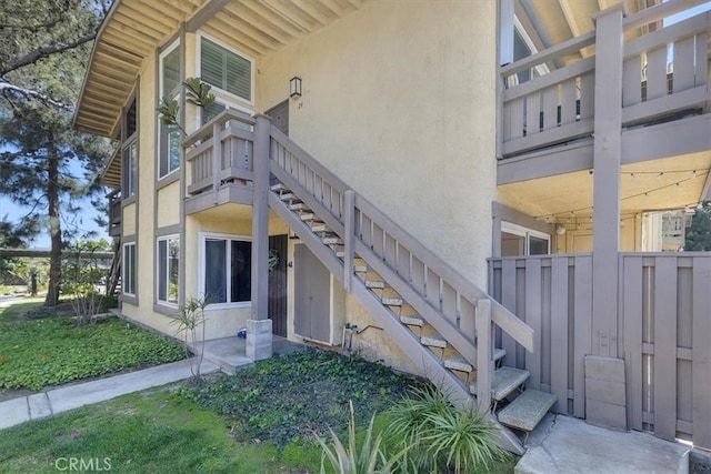entrance to property featuring stucco siding