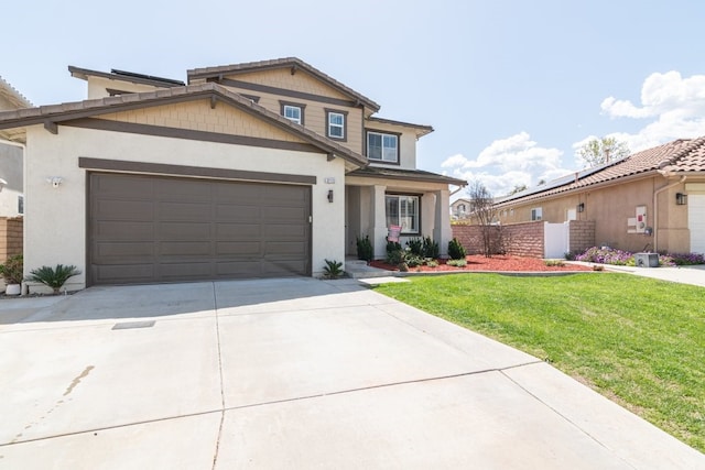 view of front of house with concrete driveway, stucco siding, an attached garage, a front lawn, and fence
