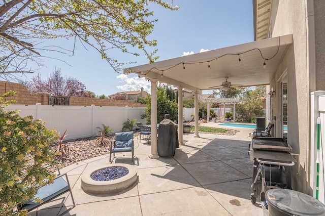 view of patio / terrace with a fenced backyard, a ceiling fan, a fenced in pool, and outdoor dining area