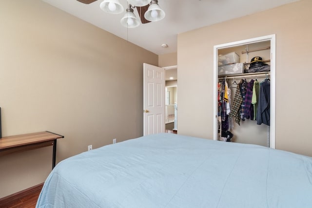 32133 Kale Ln, Winchester, CA 92596 - bedroom featuring wood finished floors, a closet, a walk in closet, and a ceiling fan