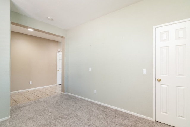 32133 Kale Ln, Winchester, CA 92596 - spare room with light carpet, baseboards, light tile patterned floors, and a smoke detector