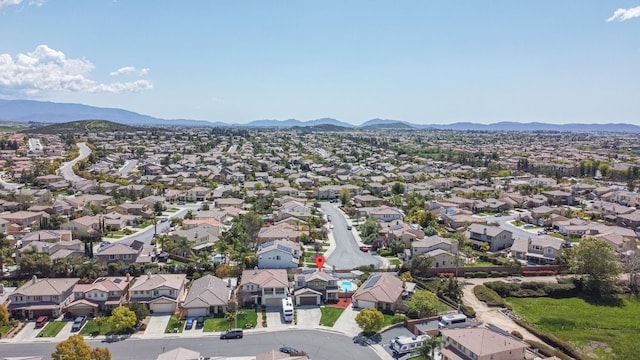 aerial view featuring a mountain view and a residential view