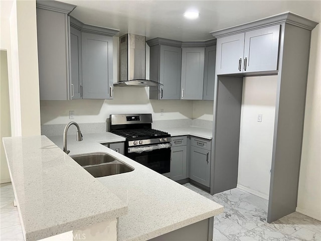 1608 N Placentia Ave, Fullerton, CA 92831 - kitchen with wall chimney exhaust hood, a sink, stainless steel gas range oven, and gray cabinetry