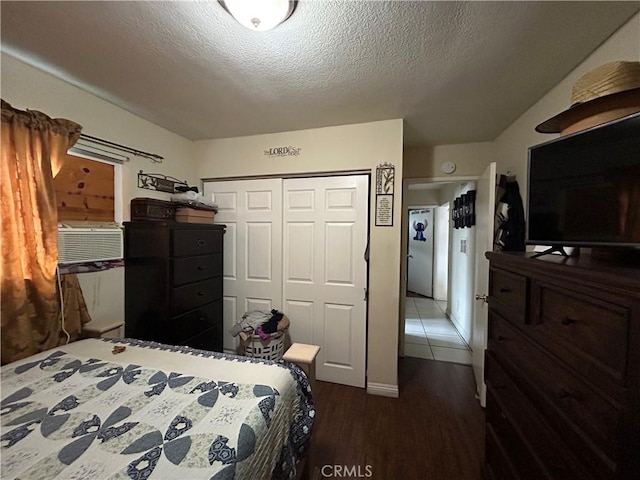 1608 N Placentia Ave, Fullerton, CA 92831 - bedroom featuring cooling unit, wood finished floors, a textured ceiling, and a closet