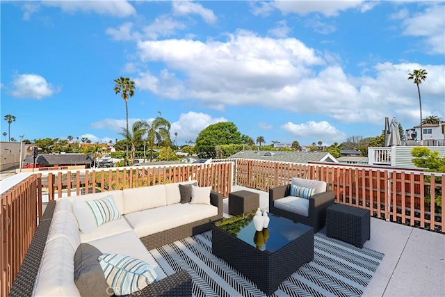 wooden terrace featuring an outdoor living space