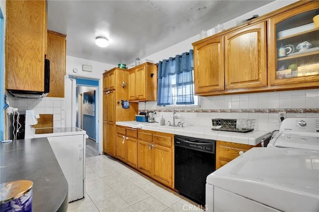 2807 W 129th, Gardena, CA 90248 - kitchen featuring brown cabinets, decorative backsplash, dishwasher, and a sink