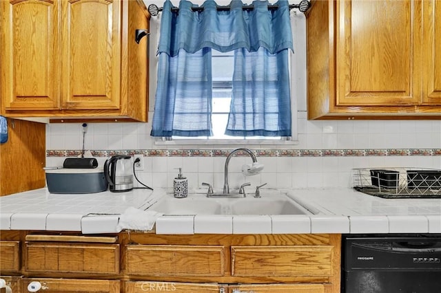 2807 W 129th, Gardena, CA 90248 - kitchen featuring backsplash, a sink, black dishwasher, and tile counters