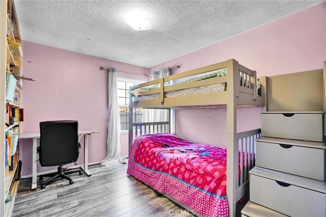 2807 W 129th, Gardena, CA 90248 - bedroom with wood finished floors and a textured ceiling