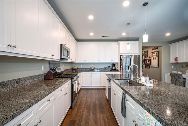 17985 Crabapple Ct, San Bernardino, CA 92407 - kitchen with dark wood-style flooring, recessed lighting, white cabinetry, stainless steel appliances, and a sink