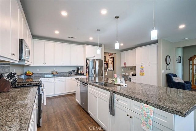 17985 Crabapple Ct, San Bernardino, CA 92407 - kitchen with a sink, white cabinets, recessed lighting, and stainless steel appliances