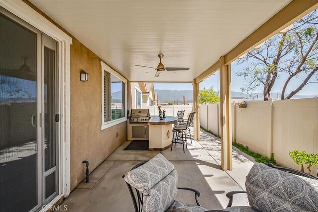 17985 Crabapple Ct, San Bernardino, CA 92407 - view of patio / terrace featuring area for grilling, a fenced backyard, a ceiling fan, grilling area, and a mountain view