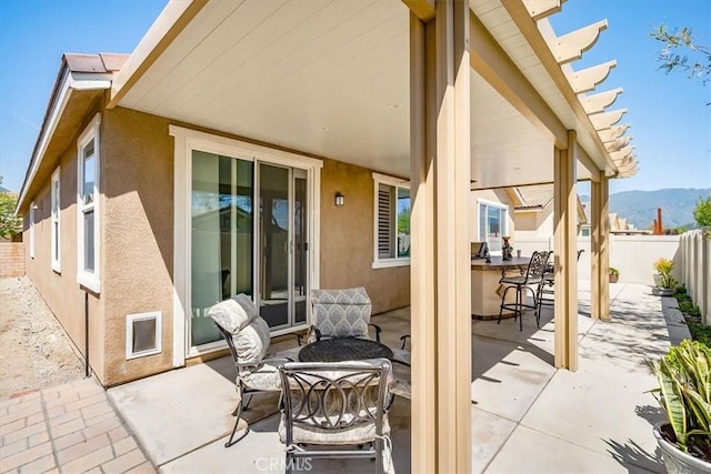17985 Crabapple Ct, San Bernardino, CA 92407 - view of patio / terrace featuring a mountain view, a fenced backyard, and outdoor dining area