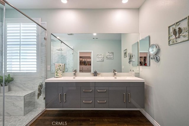17985 Crabapple Ct, San Bernardino, CA 92407 - full bathroom with recessed lighting, wood finished floors, a sink, a marble finish shower, and double vanity
