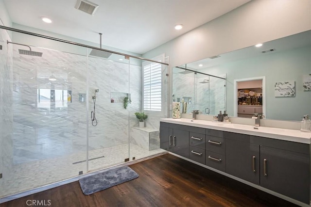 17985 Crabapple Ct, San Bernardino, CA 92407 - full bath featuring a shower stall, wood finished floors, double vanity, and visible vents