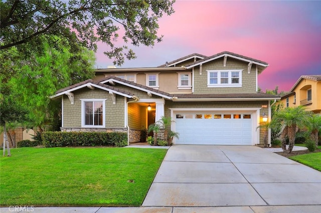 3973 Coast Oak Cir, Chino Hills, CA 91709 - craftsman inspired home featuring concrete driveway, an attached garage, stone siding, and a lawn