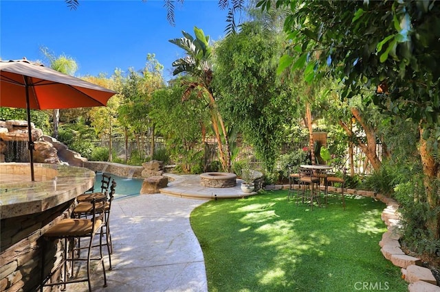 3973 Coast Oak Cir, Chino Hills, CA 91709 - view of yard featuring a fire pit, outdoor dry bar, a patio area, and fence