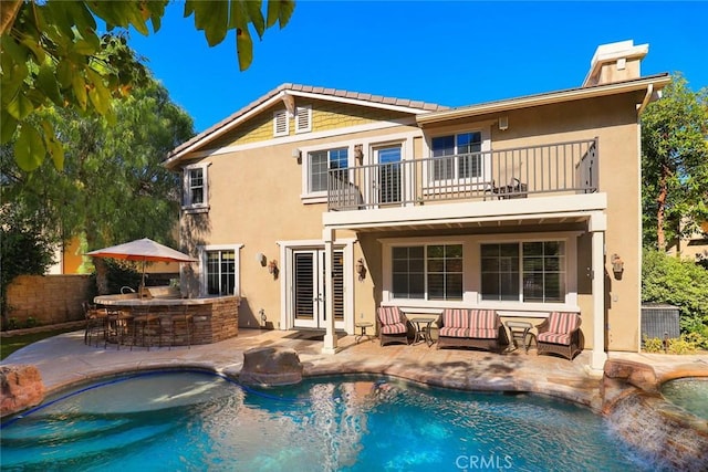3973 Coast Oak Cir, Chino Hills, CA 91709 - rear view of property with stucco siding, outdoor dry bar, a patio area, and a balcony