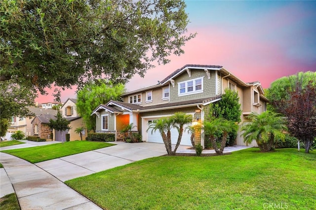 3973 Coast Oak Cir, Chino Hills, CA 91709 - view of front facade featuring a garage, a lawn, stone siding, and concrete driveway