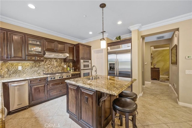 3973 Coast Oak Cir, Chino Hills, CA 91709 - kitchen featuring under cabinet range hood, backsplash, visible vents, light tile patterned floors, and appliances with stainless steel finishes