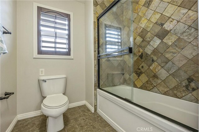 3973 Coast Oak Cir, Chino Hills, CA 91709 - bathroom with plenty of natural light, baseboards, shower / bath combination with glass door, and toilet