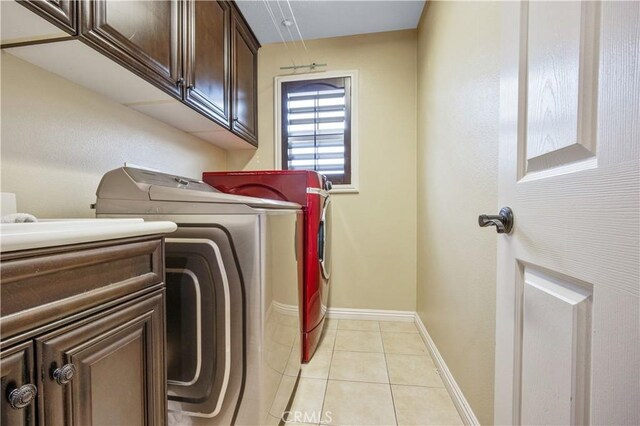 3973 Coast Oak Cir, Chino Hills, CA 91709 - clothes washing area with cabinet space, independent washer and dryer, baseboards, and light tile patterned flooring