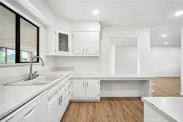 28890 Snead Dr, Menifee, CA 92586 - kitchen with light countertops, white cabinets, white dishwasher, and a sink