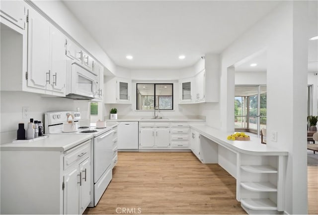 28890 Snead Dr, Menifee, CA 92586 - kitchen featuring open shelves, light wood-style flooring, white cabinets, a sink, and white appliances