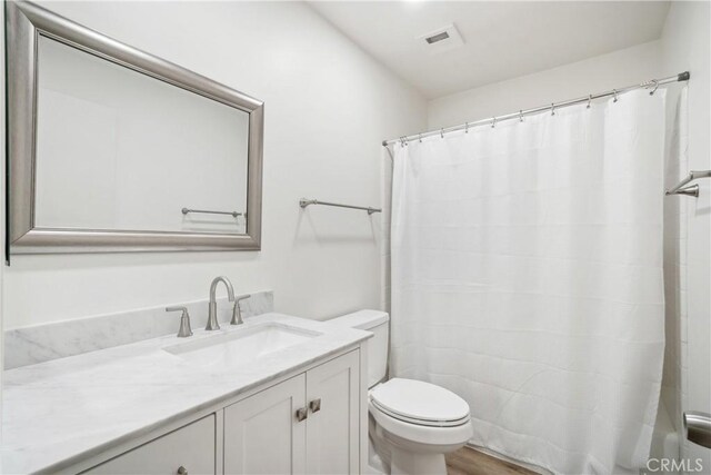 28890 Snead Dr, Menifee, CA 92586 - bathroom featuring visible vents, a shower with shower curtain, toilet, and vanity