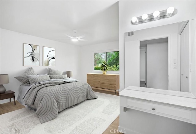 28890 Snead Dr, Menifee, CA 92586 - bedroom featuring visible vents, a ceiling fan, and light wood-style floors