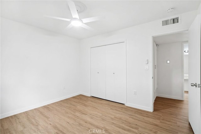 28890 Snead Dr, Menifee, CA 92586 - unfurnished bedroom with a closet, a ceiling fan, visible vents, baseboards, and wood finished floors