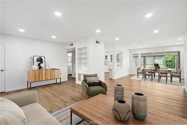 28890 Snead Dr, Menifee, CA 92586 - living room with recessed lighting, light wood finished floors, and visible vents