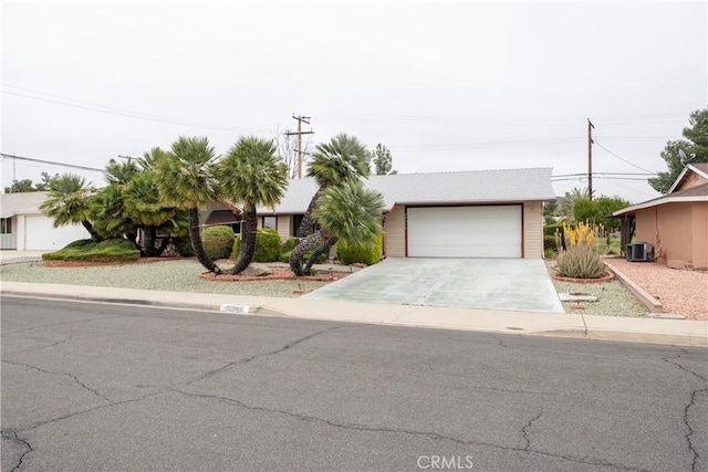 28890 Snead Dr, Menifee, CA 92586 - view of front of house featuring a detached garage and central AC