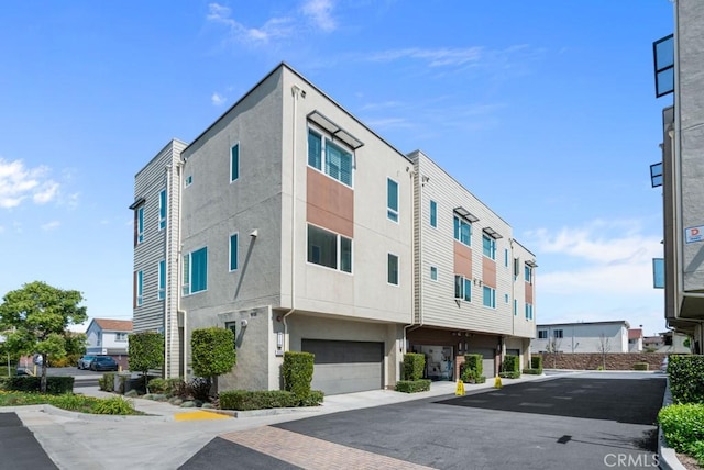 8000 7th St, Downey, CA 90241 - view of building exterior featuring a garage