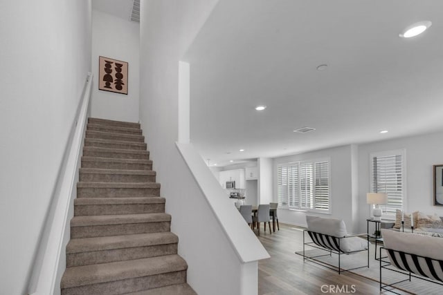 8000 7th St, Downey, CA 90241 - stairs with visible vents, recessed lighting, and wood finished floors