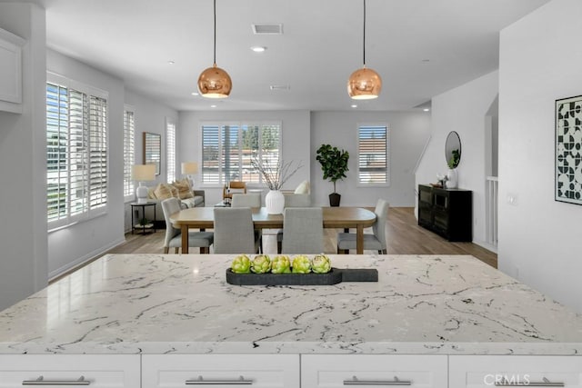 8000 7th St, Downey, CA 90241 - dining space with recessed lighting, visible vents, and light wood-style floors
