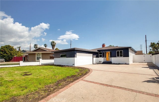 ranch-style house featuring a chimney, driveway, an attached garage, a front lawn, and fence