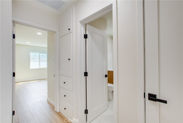 corridor with recessed lighting, visible vents, and baseboards