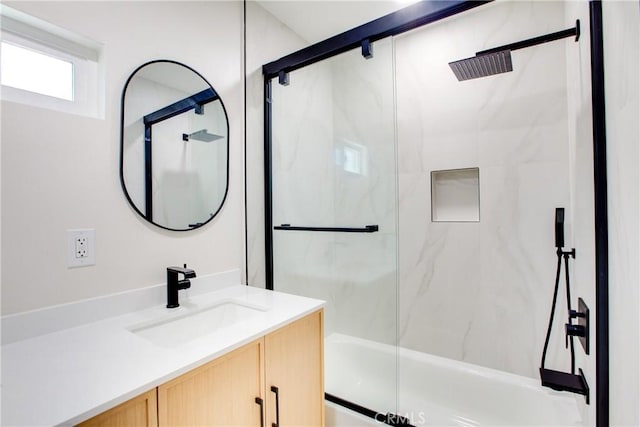 full bathroom featuring vanity and bath / shower combo with glass door