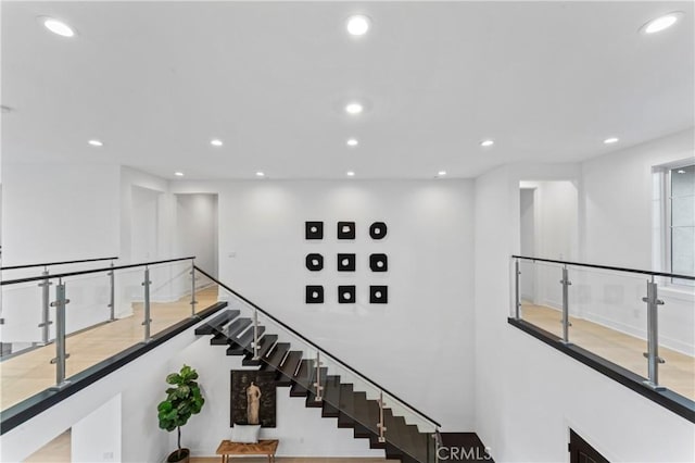 stairs featuring recessed lighting